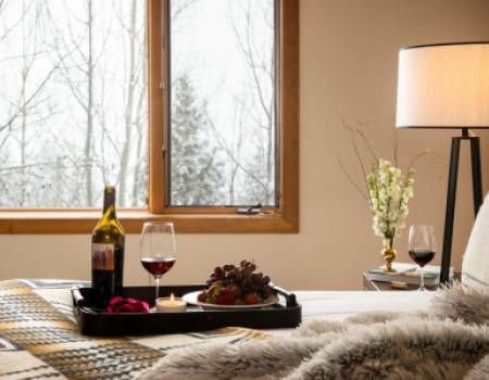 Wine and cheese on bedspread